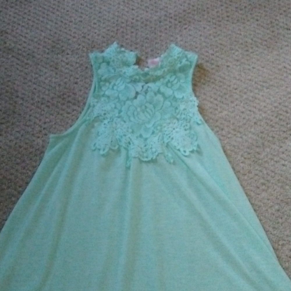 I am selling a tell light weight shirt